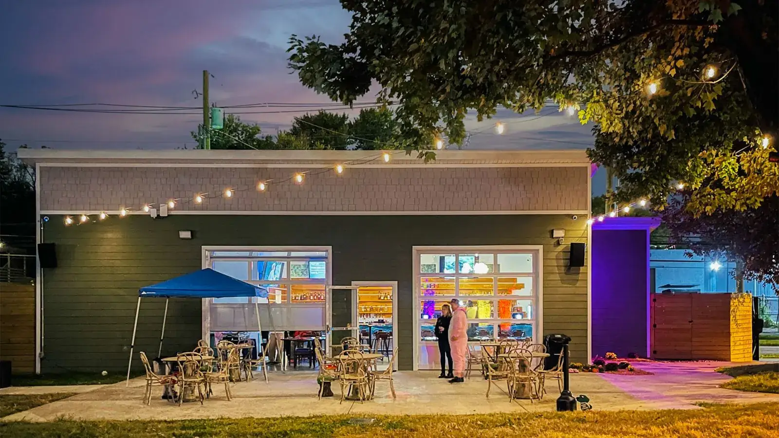 The Field Bar at Jubilee Field at dusk, string lights and patio lighting on